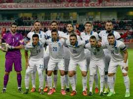Greeces players line up for photographers before the start of the friendly football match between Turkey and Greece at Basaksehir stadium on November 17, 2015 in Istanbul