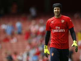 Arsenals Czech goalkeeper Petr Cech warms up before the start of their English Premier League football match against West Ham United at the Emirates Stadium in London on August 9, 2015