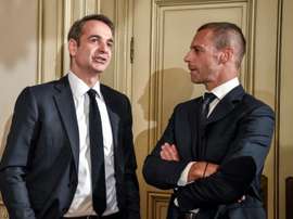 The Greek governmment and the UEFA head will try and clear up Greek football. AFP