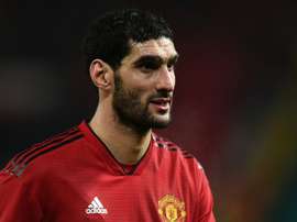 Fellaini flew back from Hong Kong to Belgium for treatment. AFP