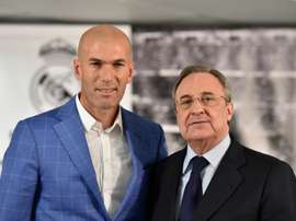 Real Madrids new coach Zinedine Zidane (L) poses with Real Madrids president Florentino Perez after a statement at the Santiago Bernabeu stadium in Madrid on January 4, 2016