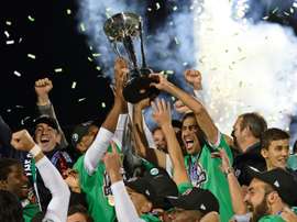 Spanish soccer star Raul (R holding trophy) celebrates with his teammates after the NASL Championship Final match between the NY Cosmos and the Ottawa Fury November 15, 2015 in Hempstead, NY