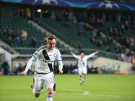 Radovic celebrates making it 2-2 after being 2-0 down. AFP