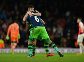 Swansea Citys defender Ashley Williams (front) celebrates scoring a goal with defender Jordi Amat during the English Premier League football match between Arsenal and Swansea City in London on March 2, 2016