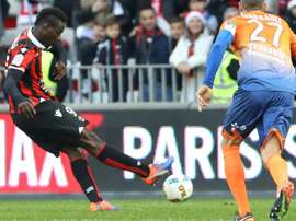 Nice forward Mario Balotelli (L) shoots a penalty to score against Dijon. AFP