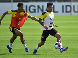 Sancho (R) has flown to Dortmund amid rumours over a move to Man Utd. AFP