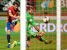 Spains midfielder David Silva shoots against Liechtensteins goalkeeper Peter Jehle on September 5, 2016