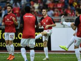 Liverpools English midfielder Jordan Rossiter (C) warms up with teammates during a training session at the Bukit Jalil Stadium in Kuala Lumpur on July 23, 2015