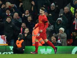 Gerrard is confident that playing football regularly will benefit Woodburn. AFP