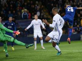 Riyad Mahrez (R) shoots past Robin Olsen (L) to scores his team's only goal. AFP