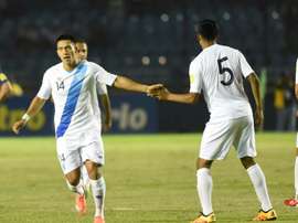 Guatamalas Rafael Morales (L) celebrates with teammate Moises Hernandez after scoring against USA in Guatemala City
