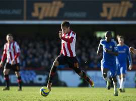 Harry Forrester on the ball for Brentford against Chelsea in an FA Cup match at Griffin Park in 2013