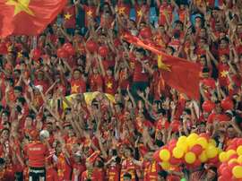 Vietnamese fans cheer on their team before the start of the Suzuki Cup semi-final 2nd leg match against Indonesia, at Hanois My Dinh stadium, on December 7, 2016
