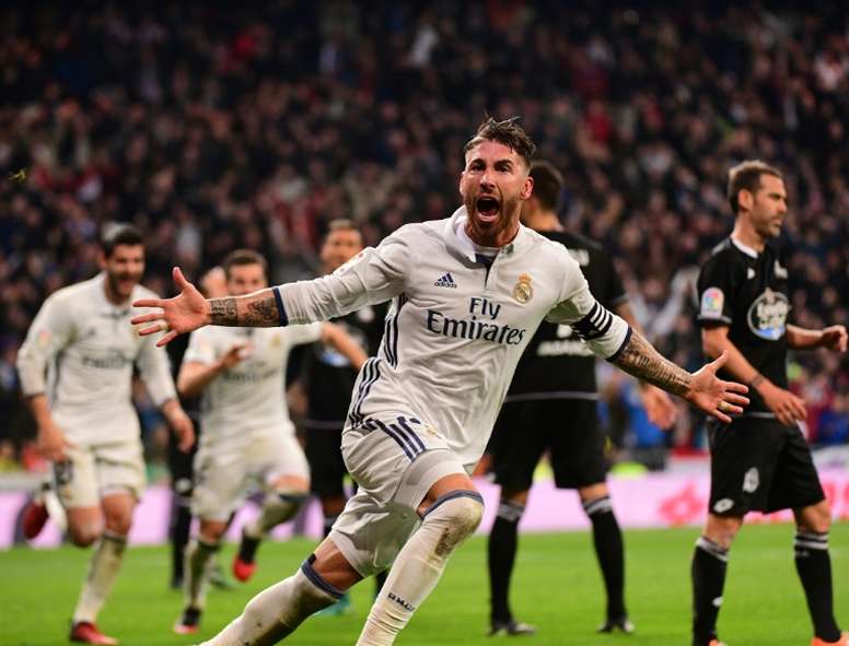 Real Madrids defender Sergio Ramos celebrates after scoring against Deportivo at the Santiago Bernabeu stadium in Madrid on December 10, 2016