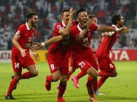 UAEs Al Ahli players celebrate after scoring a goal against Saudi Arabias Al Hilal during their AFC Champions League semi-final match in Dubai, on October 20, 2015