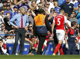 Arsenals manager Arsene Wenger (L) reacts after the sending off of defender Gabriel (R) during the English Premier League football match against Chelsea at Stamford Bridge in London on September 19, 2015