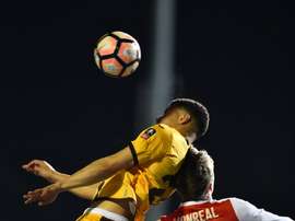 Sutton United's striker Maxime Biamou (L) vies with Arsenal's defender Nacho Monreal. AFP