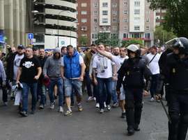 Legia Warsaw fans are escorted by Spanish police into the stadium. AFP