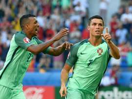 Portugal forward Cristiano Ronaldo (R) celebrates after scoring a goal against Hungary. BeSoccer