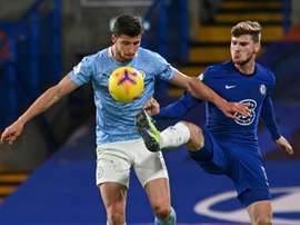 Pep Guardiola is very happy with signing Ruben Dias (L). AFP