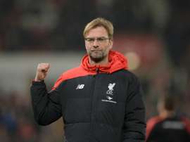 Liverpools manager Jurgen Klopp gestures during the warm up ahead of the English League Cup semi-final first leg football match at Britannia Stadium in Stoke-on-Trent, central England, on January 5, 2016