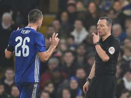 Chelsea defender John Terry (L) reacts just before Kevin Friend shows him a red card. AFP