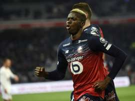 Lille up to third, Garcia's Lyon rout nine-man Nimes