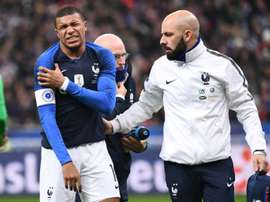 Mbappe left early. AFP