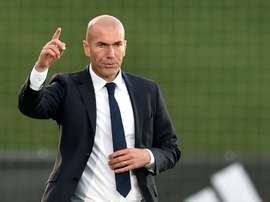 Former French football star and coach of Real Madrid Castilla Zinedine Zidane (R) gestures during the Spanish league second division football match Real Madrid Castilla vsTalavera de la Reina in Valdebebas on December 19, 2015