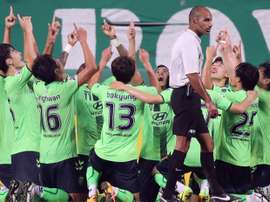 South Koreas Jeonbuk Hyundai Motors players celebrate a goal of midfielder Rodrigues Pereira. AFP