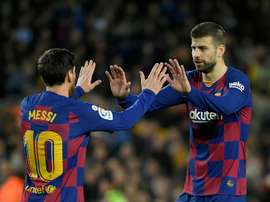 Messi e Piqué alcançam marcas históricas na Champions League. AFP