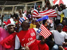 A Liberian supporter blows a vuvuzela horn during the 2014 FIFA World Cup qualifying football match Liberia vs Senegal on June 16, 2013 at the Samuel K. Doe Sports Complex in Monrovia