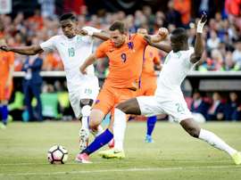 Netherlands Vincent Janssen (C) clashes with Simon Deli. AFP