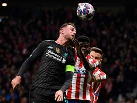 Henderson returns for Liverpool as Costa starts for Atletico. AFP