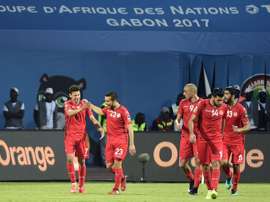 Tunisia's Naim Sliti (C) celebrates with teammates after scoring against Algeria. AFP