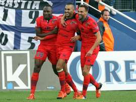Ajaccios forward Khalid Boutaib (C) is congratulated by teammates after scoring a goal during the L1 football match against Bastia on November 22, 2015, at the Armand Cesari stadium