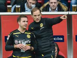 Dortmund's head coach Thomas Tuchel gives Dortmund's midfielder Mario Goetze instructions during the German first division Bundesliga football match between FC Ingolstadt 04 and Borussia Dortmund in Ingolstadt, southern Germany, on October 22, 2016