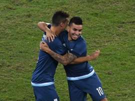Argentina player Angel Correa (R) celebrates after scoring against Algeria in Rio de Janeiro, Brazil, on August 7, 2016