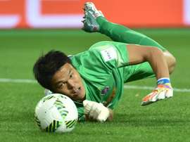 Japans Sanfrecce Hiroshima goalkeeper Takuto Hayashi blocks a shot on December 13, 2015