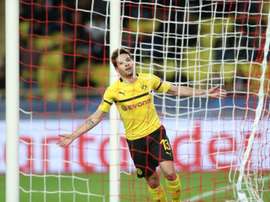 Guerreiro scored twice to secure top spot for Dortmund. AFP