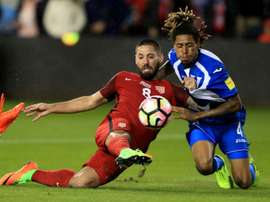 Clint Dempsey of the United States scores one of his three goals in a 6-0 thrashing of Honduras. AFP