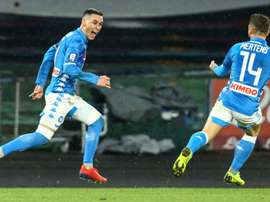 Napoli beat Lazio to keep sight of Juventus.