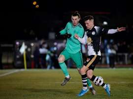 Bale came off holding his ankle. AFP