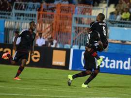 Pirates players celebrate a goal during the second leg of the semi final of the 2015 CAF - Confederation of African Football Cup - between Egyptian team Al Ahly and South African team Orlando Pirates on October 4, 2015 at Suez Stadium