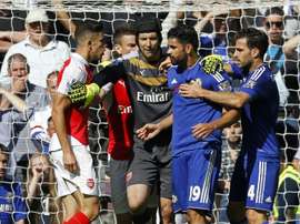 Arsenals Brazilian defender Gabriel (L) and Chelseas Brazilian-born Spanish striker Diego Costa (2nd R) are separated by Arsenals Czech goalkeeper Petr Cech (C) as they clash during the English Premier League football in Lond on September 19, 2015