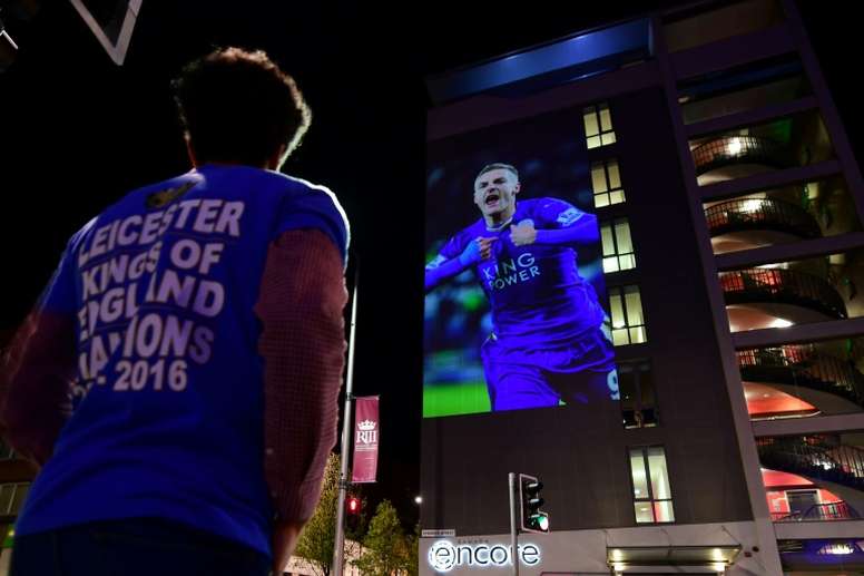 A Leicester City football fan celebrates the teams unlikely victory in the 2016 Premier League title race