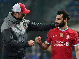 Liverpools Mohamed Salah (right)has tested positive for coronavirus. AFP