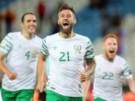 Irelands Daryl Murphy (C) celebrates scoring with teammates John OShea (L) and Stephen Quinn on September 5, 2016