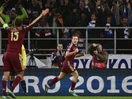 Russias defender Oleg Kuzmin (C) celebrates after scoring a goal during a UEFA Euro 2016 group G qualifying football match against Montenegro at the Otkrytie Arena stadium in Moscow on October 12, 2015