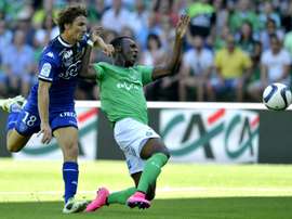 Bastias midfielder Yannick Cahuzac (L) clashes with Saint-Etiennes forward Jean-Christophe Bahebeck during a French L1 football match on August 30, 2015, at the Geoffroy Guichard Stadium in Saint-Etienne, central France